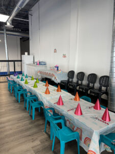 thrive gymnastics aurora birthday party rainbow theme party hats table