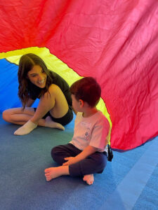 thrive gymnastics aurora birthday party toddler coach rainbow parachute