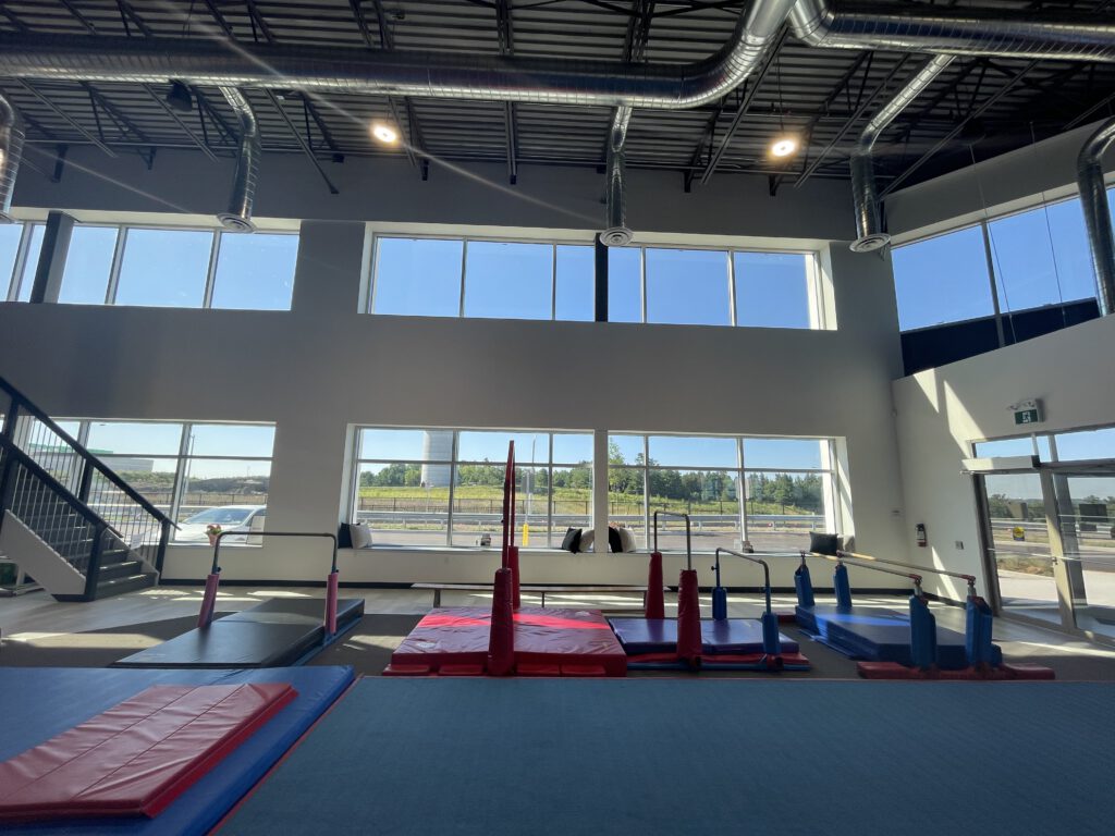 thrive-gymnastics-aurora-gym-facility-bars-beam-natural-light thrive gymnastics aurora gym facility bars beam natural light