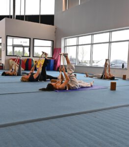 thrive gymnastics aurora ontario adult yoga class stretching 1