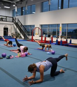 thrive gymnastics aurora ontario adult yoga fitness class floor view 1