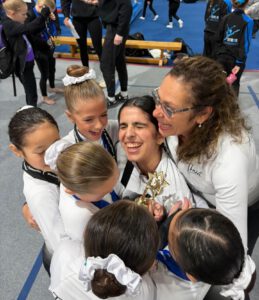 thrive gymnastics aurora ontario coaches gymnasts trophy celebration at meet