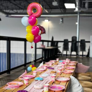 thrive gymnastics aurora ontario donut theme party table mezzanine view