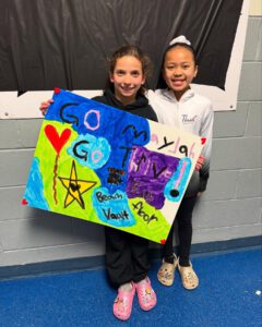 thrive gymnastics aurora ontario go mya fan support sign at provincials