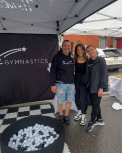 thrive gymnastics aurora ontario staff at community market booth