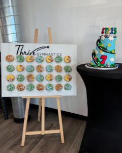 thrive gymnastics aurora ontario thrive logo donut wall birthday decor