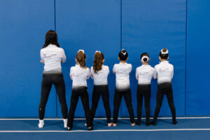 thrive gymnastics aurora team back view thrive jacket logos