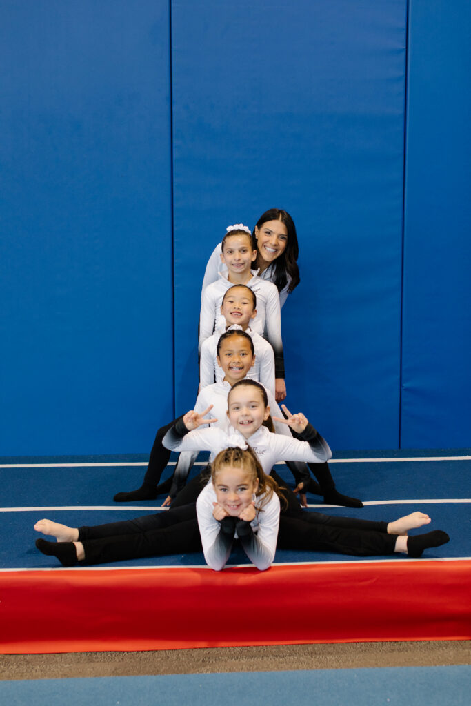 thrive-gymnastics-aurora-team-pyramid-splits-coach-formation thrive gymnastics aurora team pyramid splits coach formation