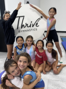 young gymnasts thrive logo